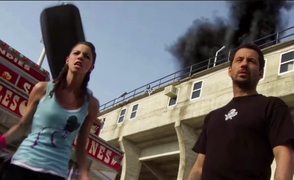 Nadia about to get hit in the head by a tyre in The Final Destination (2009)