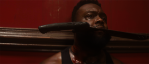 A man takes a machete to the face