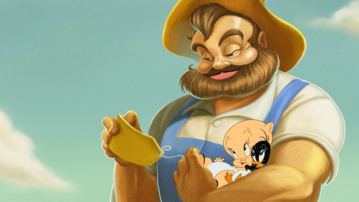 Farmer Jim (Fred Tatasciore) holds baby Porky Pig (Eric Bauza) and baby Daffy Duck (Eric Bauza) while reading a note attached to Porky’s foot, in the film, “The Day the Earth Blew Up” (2024).