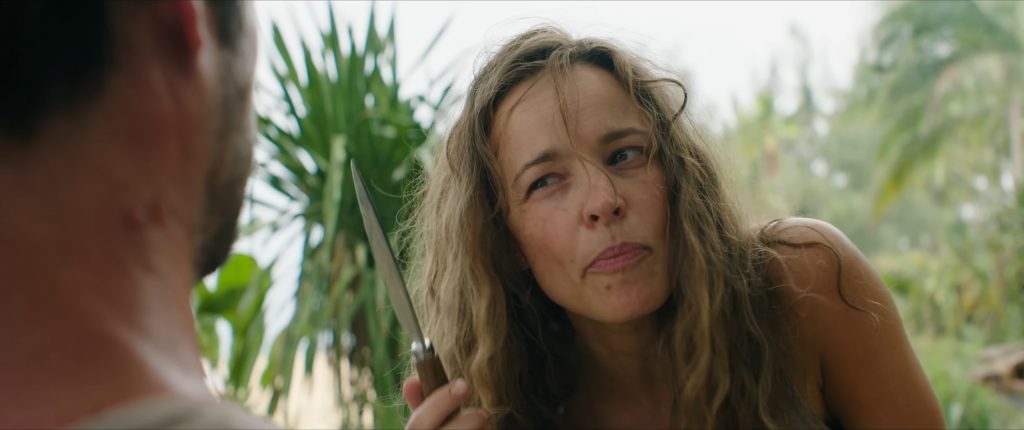 Linda Liddle (Rachel McAdams) brandishes a knife at Bradley Preston (Dylan O'Brien)